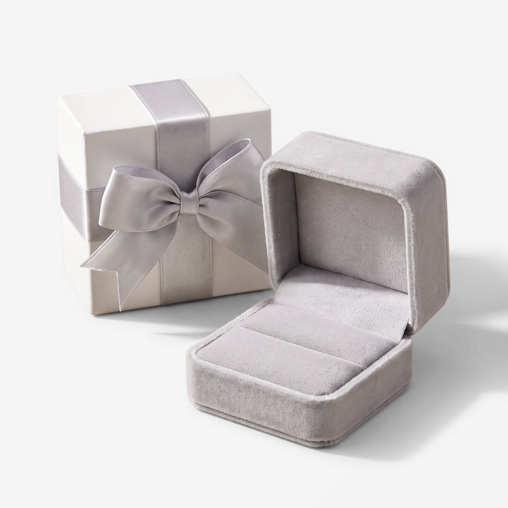 The gift box, with ribbon and a velvet jewellery case