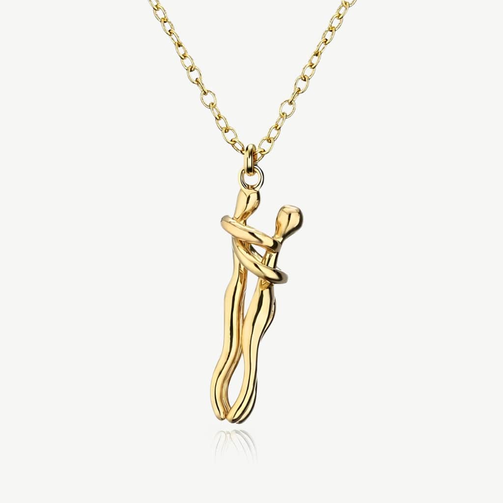 Hug necklace, all gold pendant of two figures embracing, on a gold chain