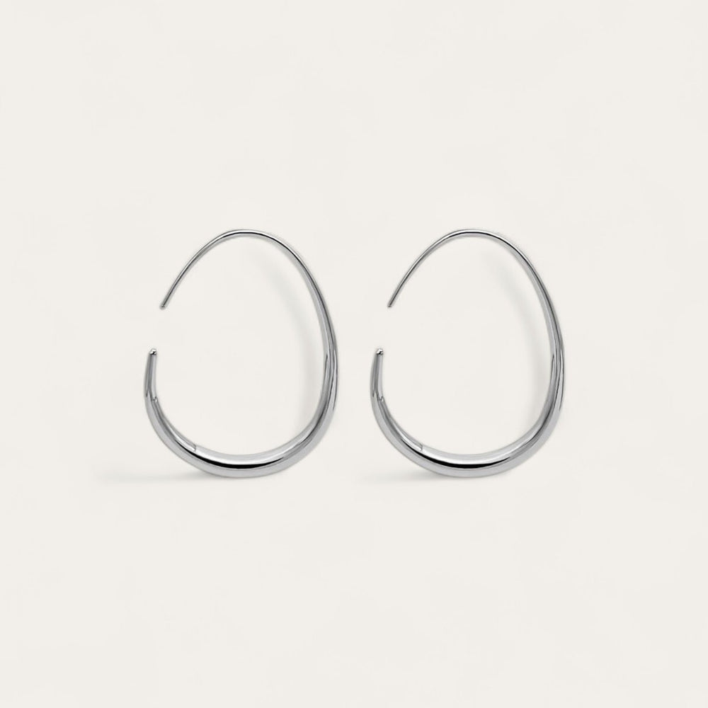 The pair of silver KOVA Hoops laid flat, seen from the front
